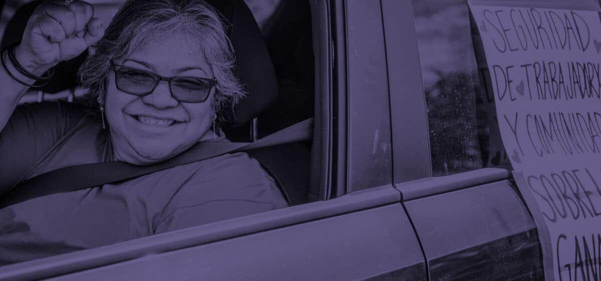 Woman smiling while in a car.